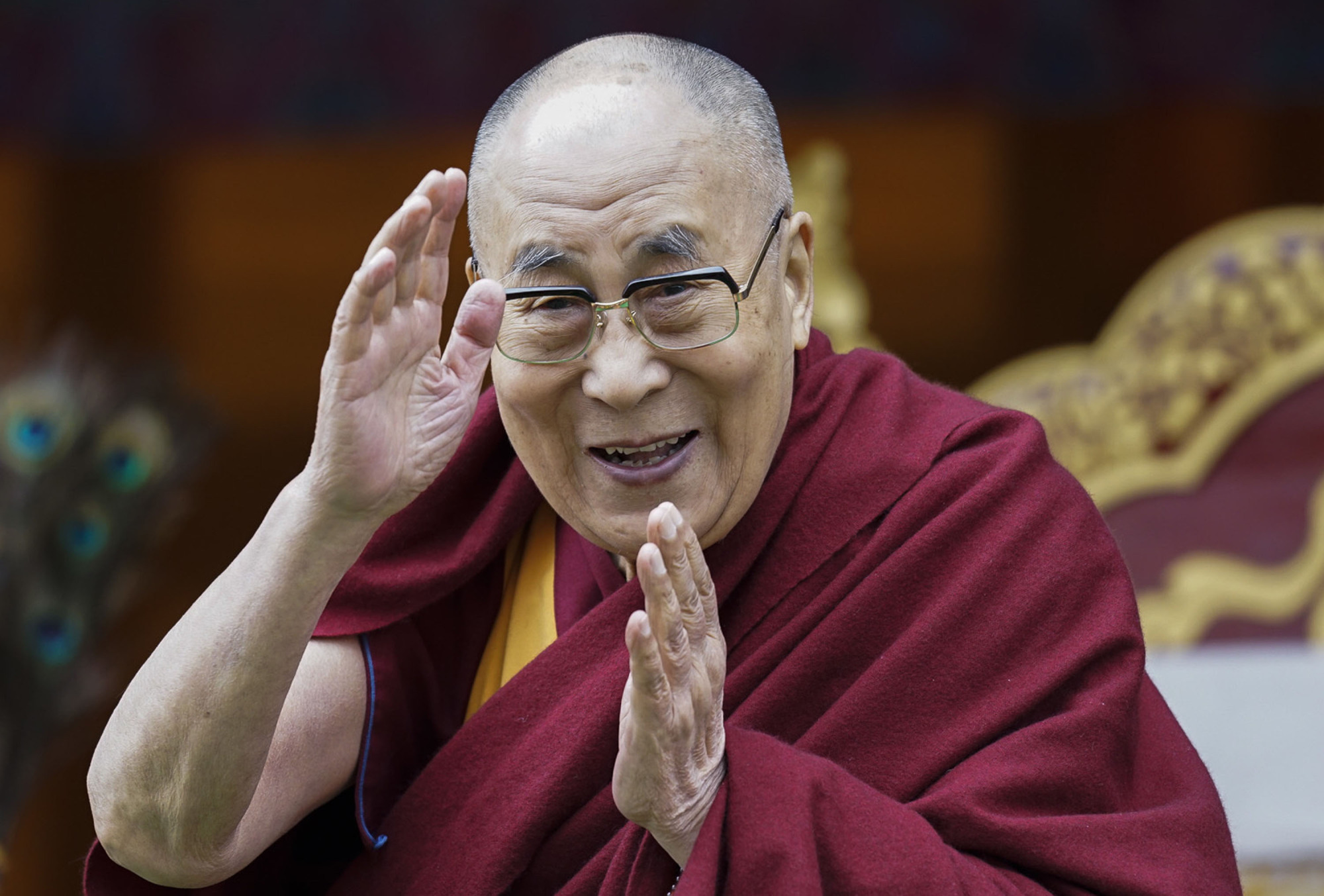 FILE - In this April 5, 2017, file photo, Tibetan spiritual leader the Dalai Lama greets devotees at the Buddha Park in Bomdila, Arunachal Pradesh, India. More than 150 Tibetan religious leaders say their spiritual leader, the Dalai Lama, should have the sole authority to choose his successor. A resolution adopted by the leaders at a conference on Wednesday, Nov. 27, 2019, says the Tibetan people will not recognize a candidate chosen by the Chinese government for political ends. ( AP Photo/Tenzin Choejor, File)